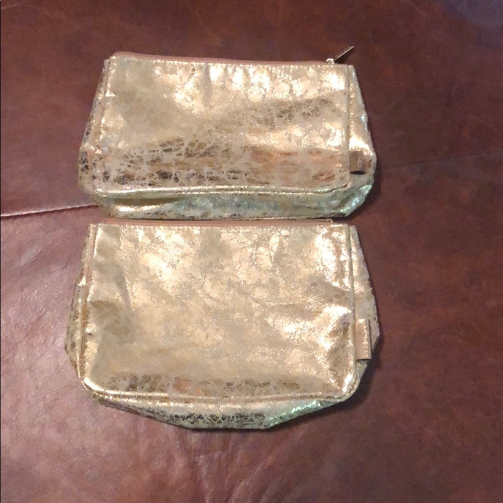 2 gold makeup bags